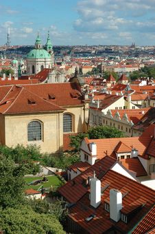 St. Nicholas Church And The Red Roofs In Prague Stock Photo