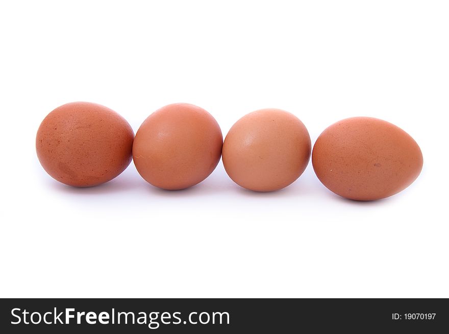 Close up shot of four eggs on white background