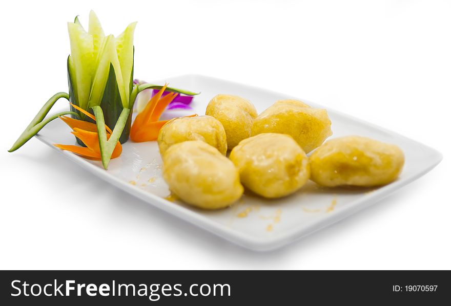 Caramelized fried bananas garnish with vegetables