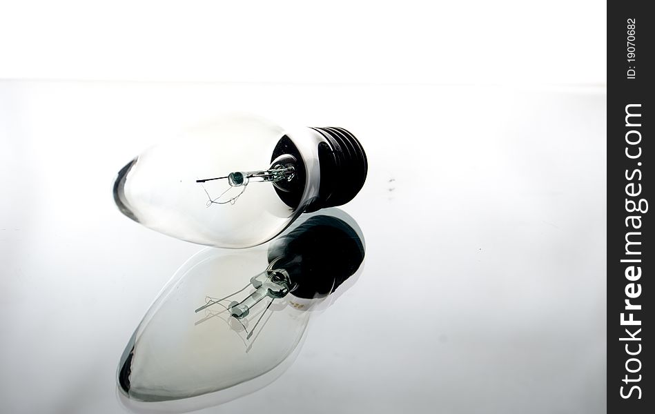 Incandescence bulb on a light white background. Incandescence bulb on a light white background