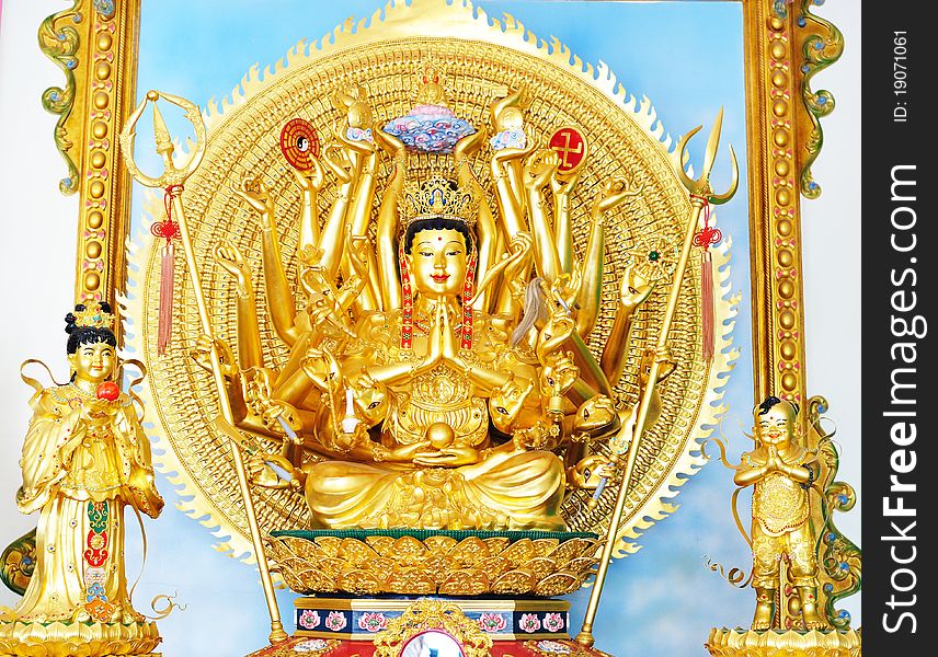 Buddhist Golddess mercy statue isolated on gold. Buddhist Golddess mercy statue isolated on gold