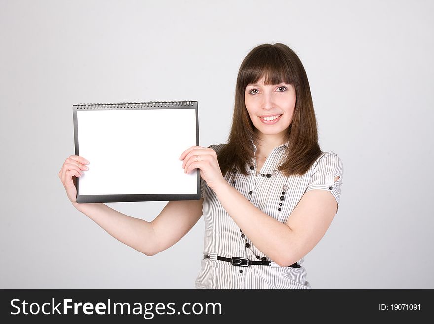 Happy young female holding blank paper. Happy young female holding blank paper