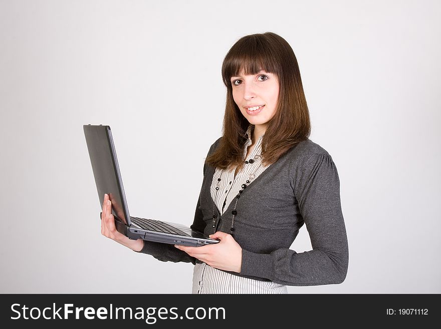 Pretty girl standing with laptop. Pretty girl standing with laptop