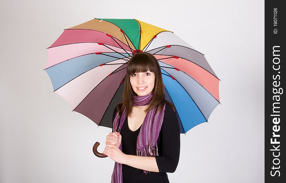 Young woman with colorful umbrella. Young woman with colorful umbrella