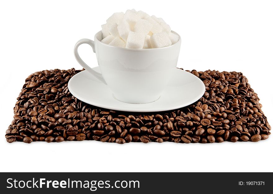 Coffee cup with beans and lump sugar isolated on white