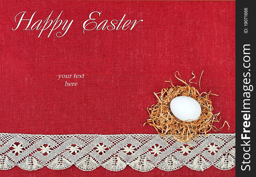 Easter composition: small nest with white egg on wine red flax background decorated with lace