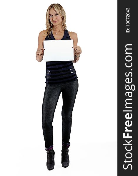 Portrait of a happy woman holding blank billboard against white background