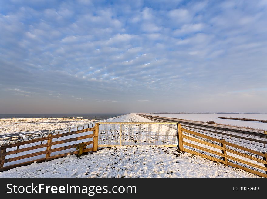 Fence at a winter dike