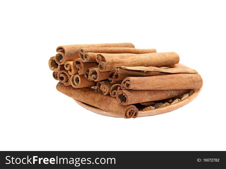 Cinnamon on a plate on a white background
