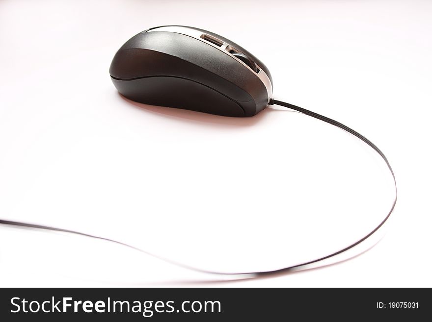 Computer mouse with cable on white background