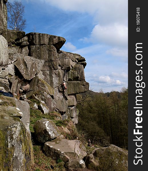 Landscape view of rocks in the peak district, Derbyshire, with man climbing. Landscape view of rocks in the peak district, Derbyshire, with man climbing.