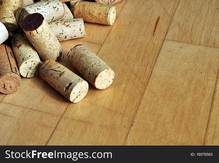 Unlabeled corks and a maple wood floor background with text space. Unlabeled corks and a maple wood floor background with text space