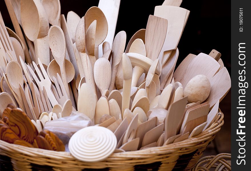 Wooden spoons inside a wicker basket