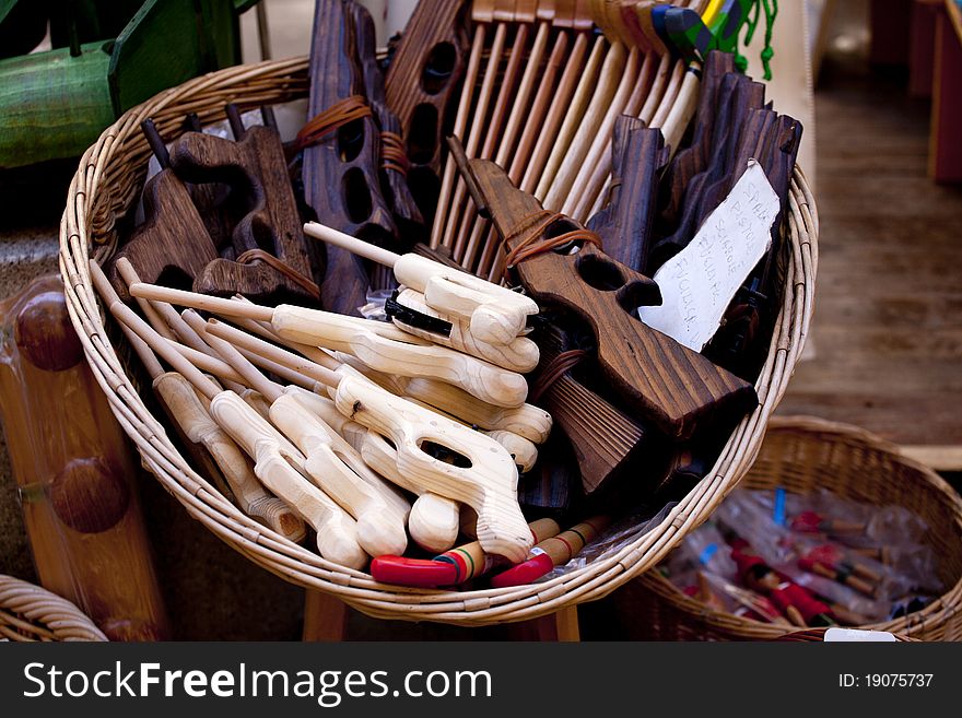 Wicker basket with toy wooden guns