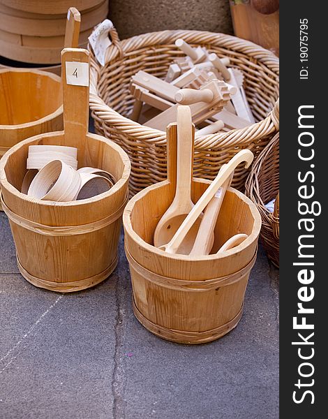 Wooden spoons inside a buckets in a street market