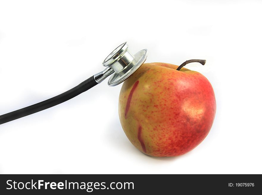 Stethoscope and red apple on white. Stethoscope and red apple on white