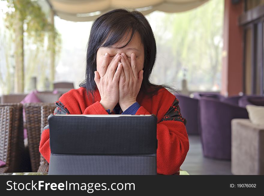 Thinking business woman with laptop