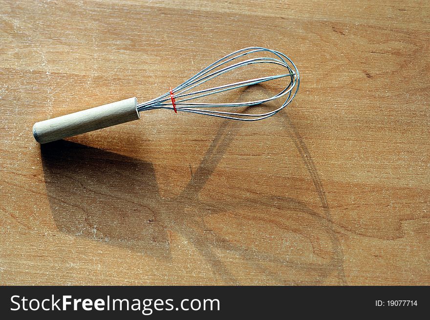 An image of a whisk on the kitchen table