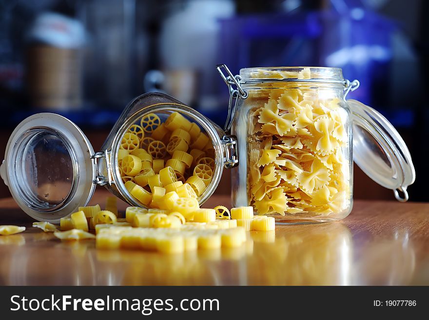 An image of yellow pasta in two jars. An image of yellow pasta in two jars