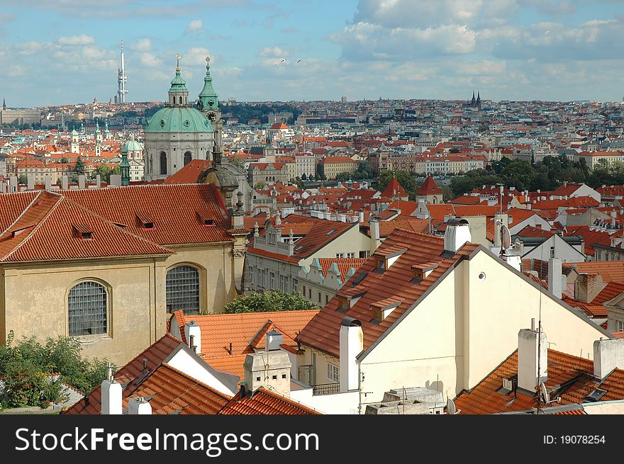 St. Nicholas Church And The Red Roofs In Prague