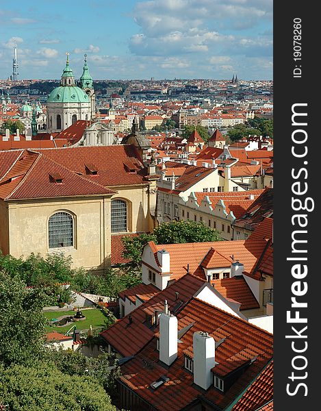 St. Nicholas Church And The Red Roofs In Prague