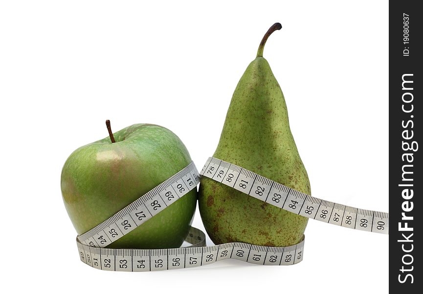Photo of a green apple And pear wrapped up in tailor's meter. Photo of a green apple And pear wrapped up in tailor's meter
