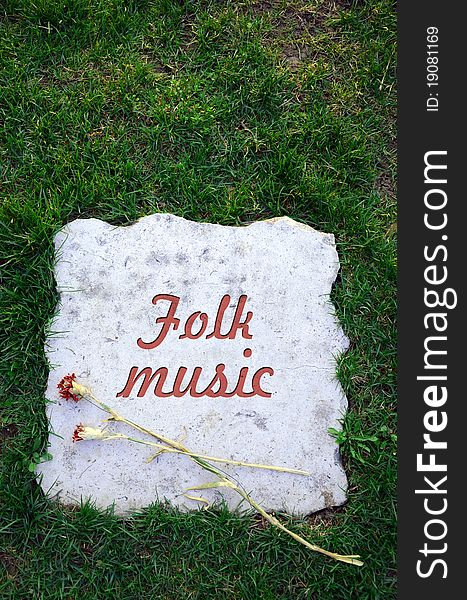 Tombstone dedicated to folk music. Tombstone dedicated to folk music