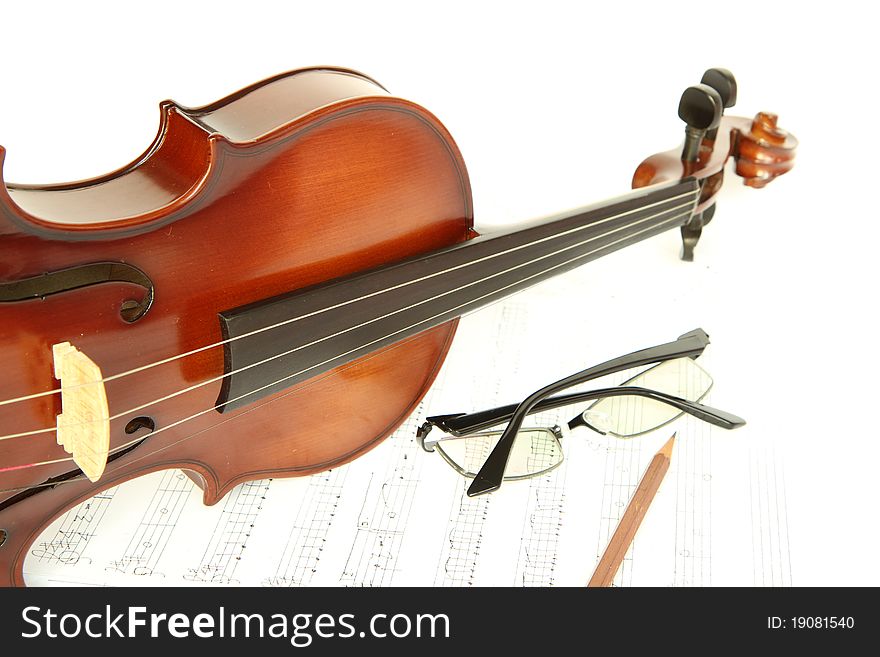 Closeup of an antique violin and note. Closeup of an antique violin and note