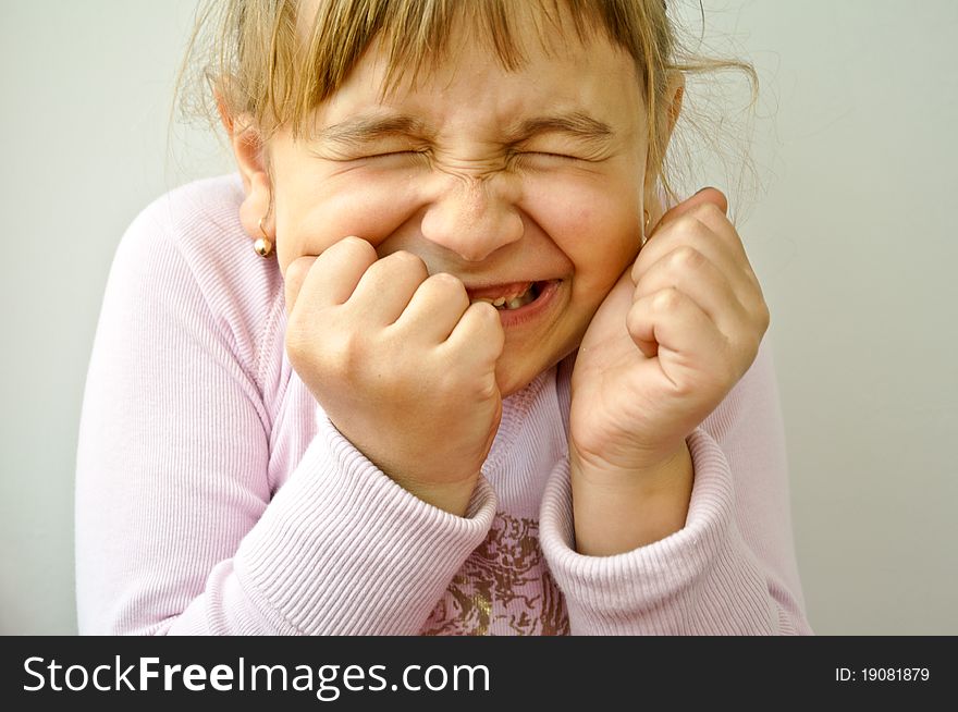 Beautiful blonde little girl being joyful