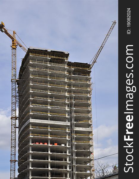 Construction of a concrete structure. Construction site with cranes.