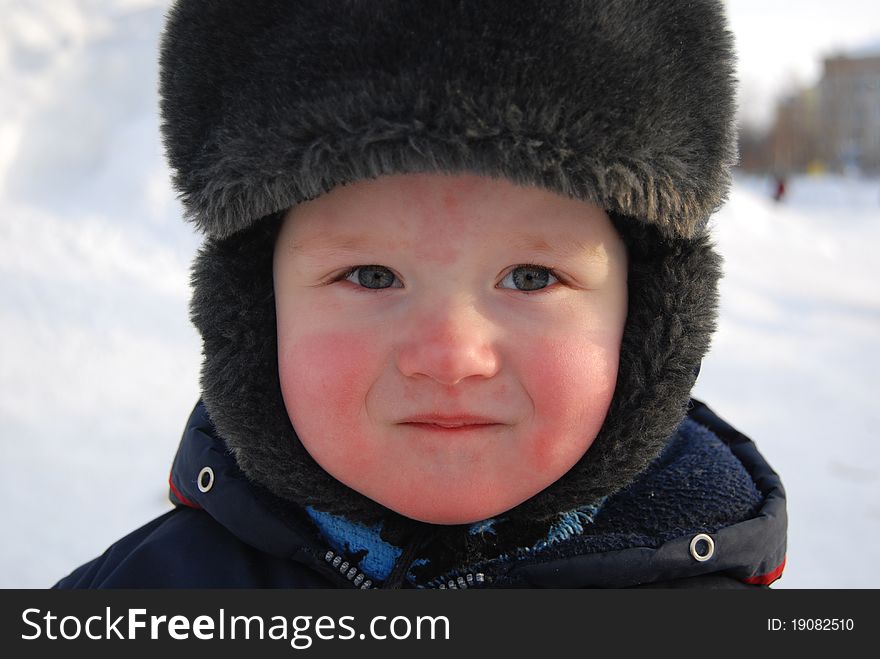 Portrait of a joyful little child in winter. Portrait of a joyful little child in winter