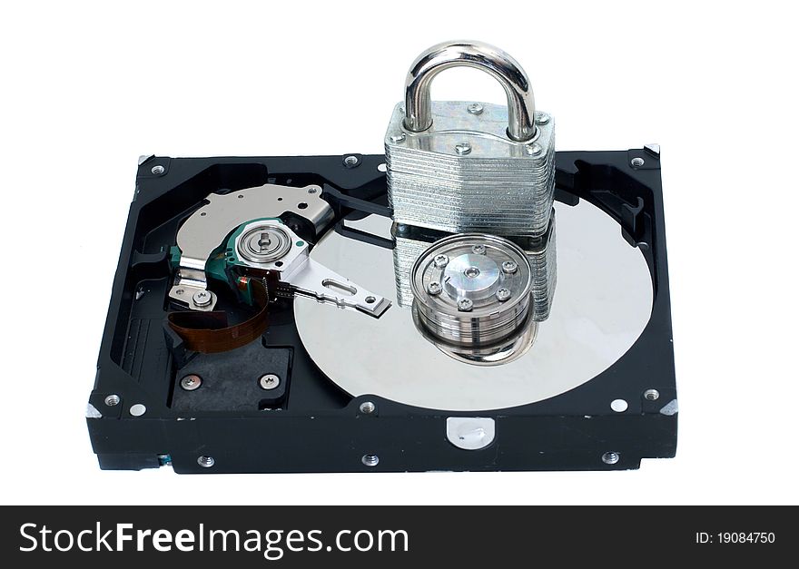 A strong lock sitting on a hard drive to represent security. A strong lock sitting on a hard drive to represent security.