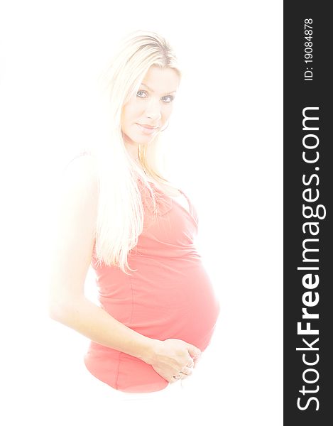 IN studio photograph of a lovely pregnany woman. IN studio photograph of a lovely pregnany woman