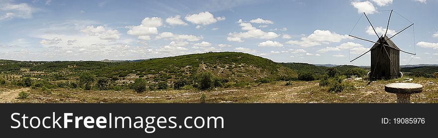 Old wooden windmill from Oeste region and panoramic view of the landscape, Portugal. Old wooden windmill from Oeste region and panoramic view of the landscape, Portugal