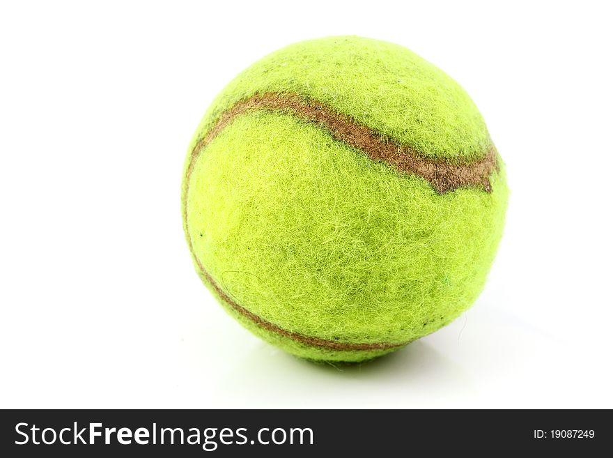 Old tennis ball on white blackground