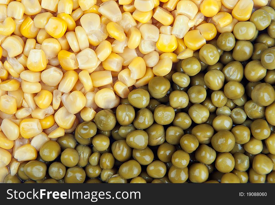 Corn kernels and fresh peas background. Corn kernels and fresh peas background