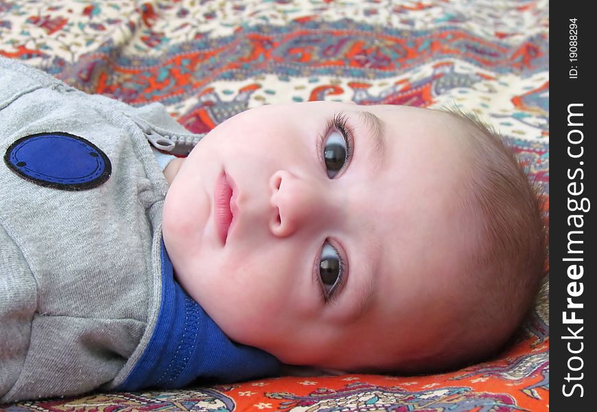 Cute baby boy with attractive glance