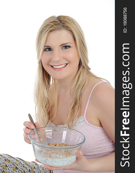 Pretty woman having muesli cereals for breakfast. isolated on white