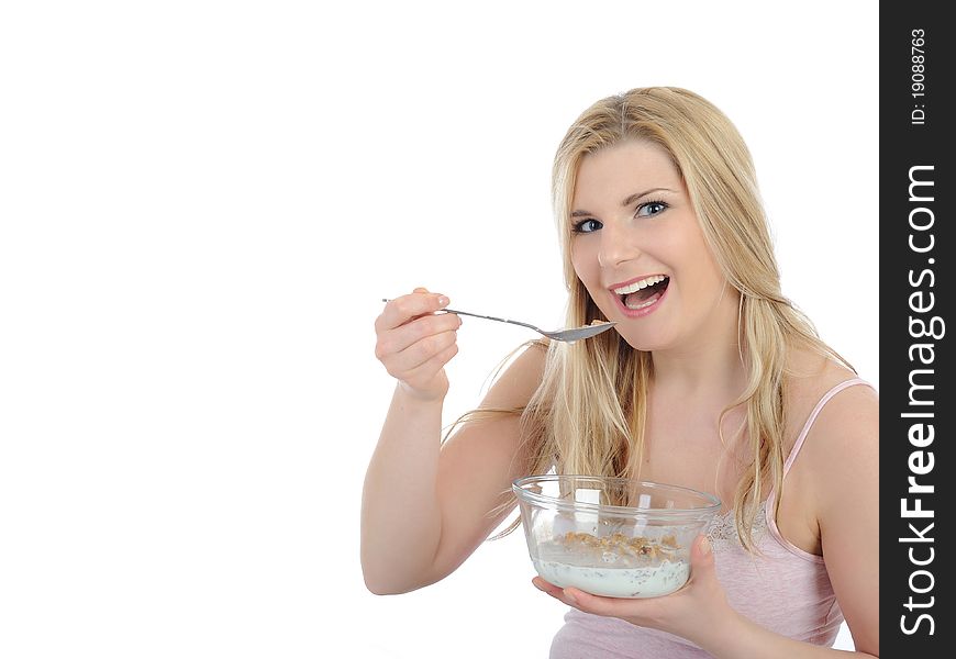 Pretty woman having muesli cereals for breakfast. isolated on white