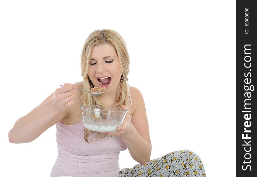 Pretty woman having muesli cereals for breakfast. isolated on white