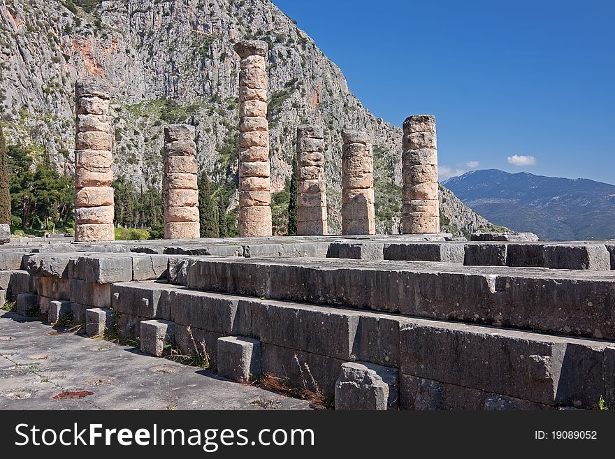 The ruins of Temple of Apollo in the archaeological site of Delphi in Greece; Delphi was believed to be the centre of the earth. The ruins of Temple of Apollo in the archaeological site of Delphi in Greece; Delphi was believed to be the centre of the earth