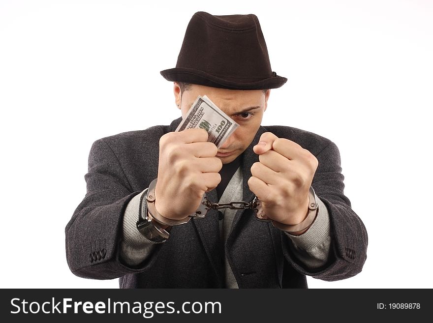 Man with handcuff and dollar bank notes. Man with handcuff and dollar bank notes