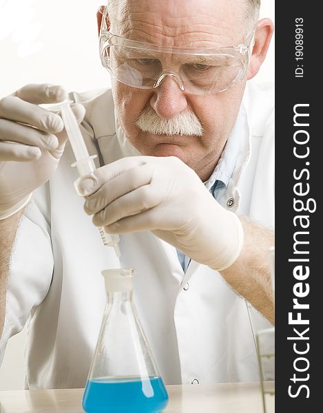 Scientist working with chemicals isolated on white