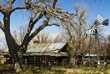 Dilapidated Desert Farm House With Windmill Stock Photos Dilapidated Desert Farm House With Windmill Stock Photos