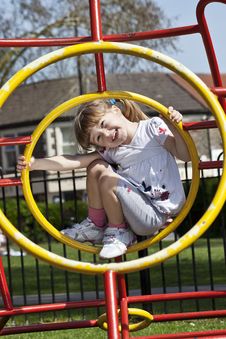 Girl On Playground Stock Images