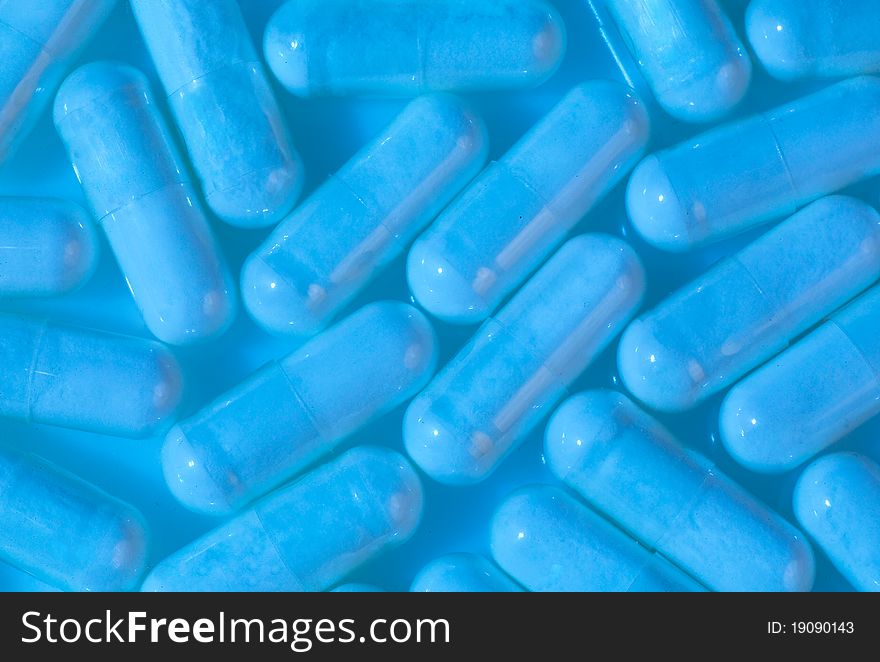 Pills close-up with blue lighting. Pills close-up with blue lighting