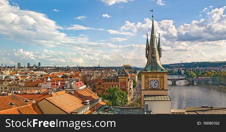 Panoramic view of the city with a historic tower in the foreground. Panoramic view of the city with a historic tower in the foreground