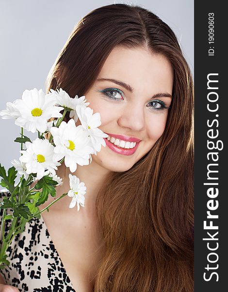 Portrait of beautiful young happy woman with flowers. Portrait of beautiful young happy woman with flowers