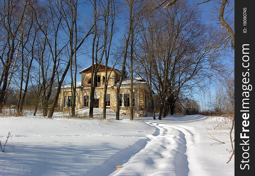The old mansion, now abandoned, is surrounded by trees. The old mansion, now abandoned, is surrounded by trees