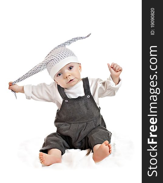 Caucasian baby boy in a cap on a white background